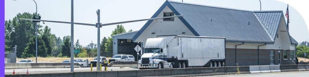 A truck stopped at a weigh station.