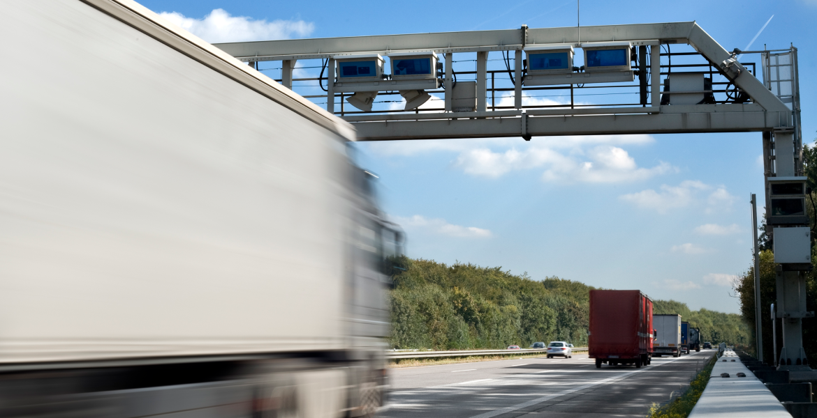toll management for trailer rental and leasing. Truck driving on a highway.