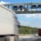 toll management for trailer rental and leasing. Truck driving on a highway.